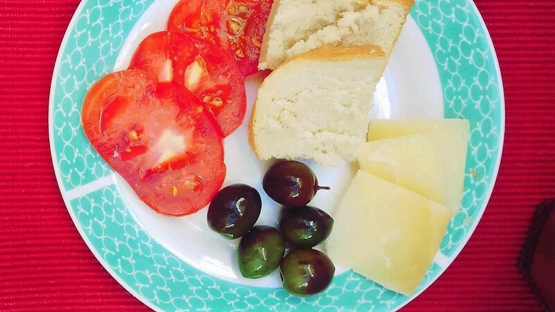 cheese, olives and sliced tomato