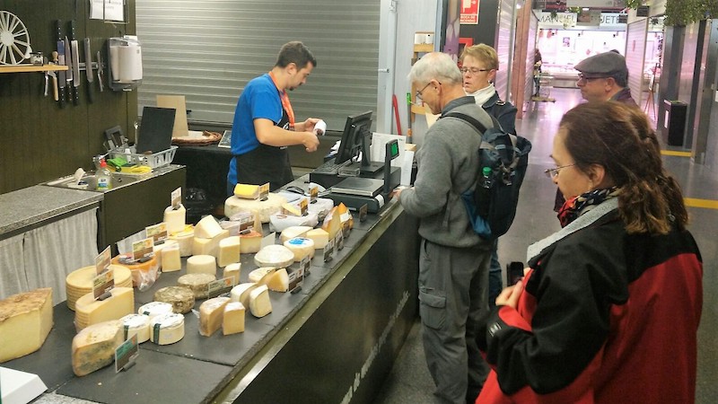 People waiting in line in Madrid food store