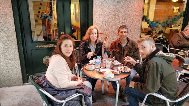 Tourists siting at a cafe table