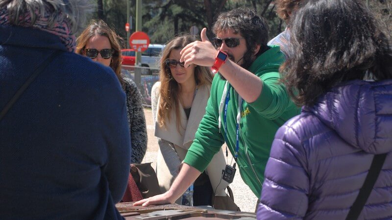 travel guide with group of tourists