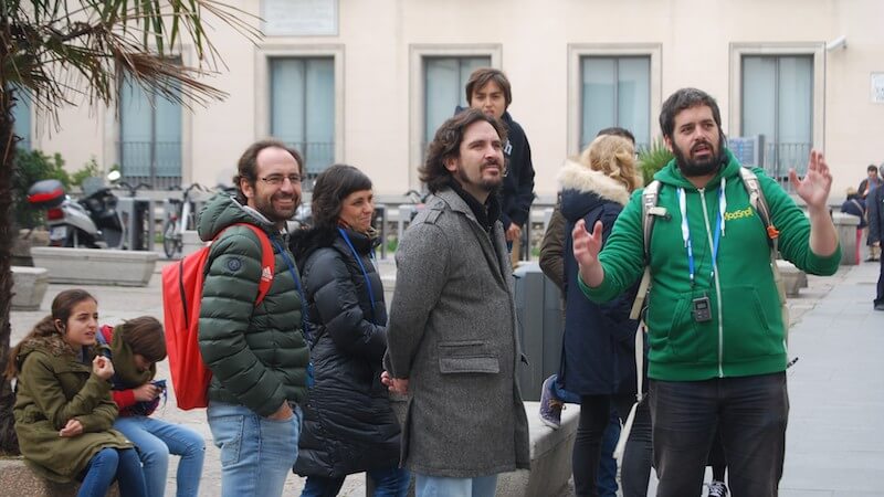 travel guide with group of tourists