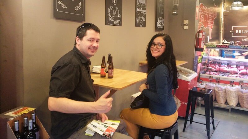 two persons sitting in a local bar