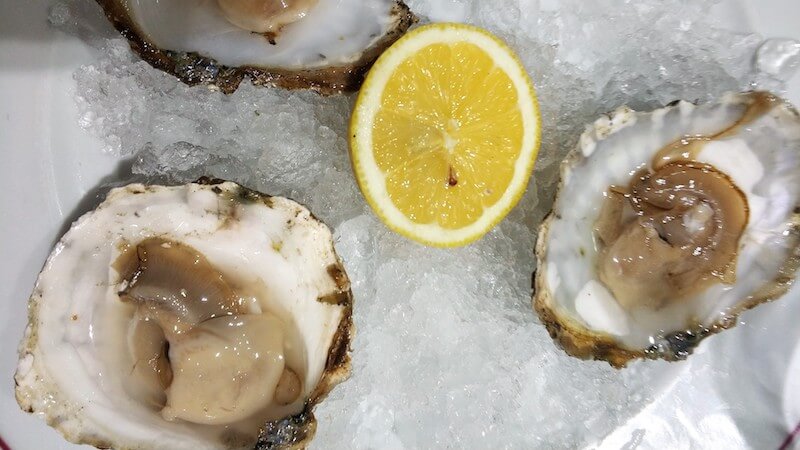Seashells served with lemon
