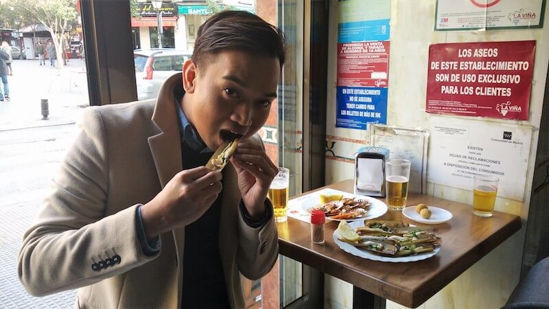 Person eating in local seafood bar
