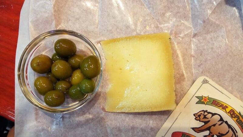 Served cheese and olives